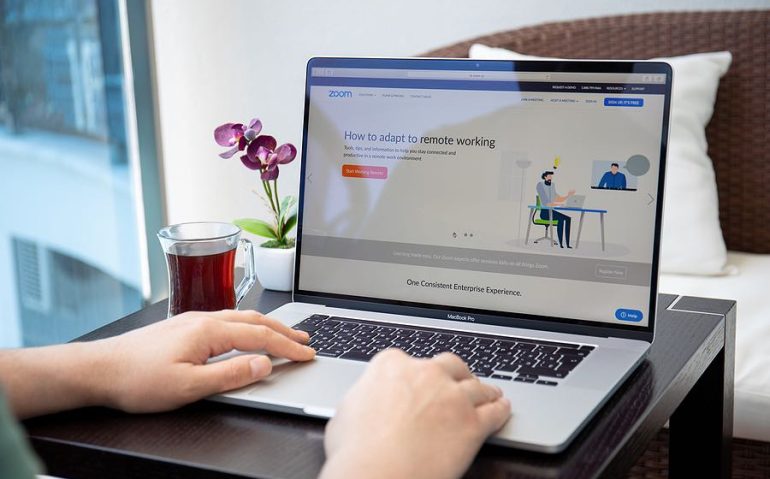 Alanya, Turkey - April 10, 2020: Man hand on Macbook Pro 16 with calling Zoom Video Communications application. Macbook Pro 16 was created and developed by the Apple inc.