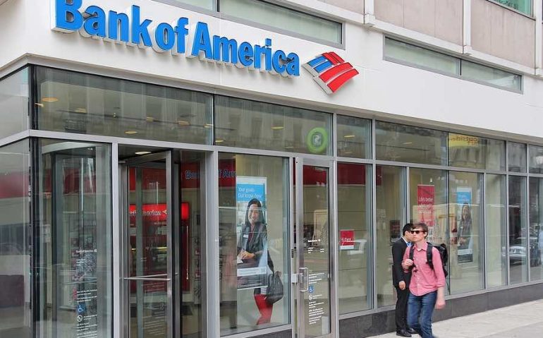 PHILADELPHIA, USA - JUNE 11, 2013: Person walks by Bank of America branch in Philadelphia. Bank of America is the 2nd largest bank holding in the USA with assets of 2.1 trillion USD (2013).