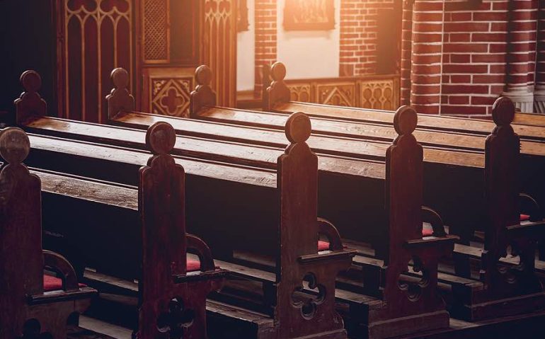 Rows of church benches at the old european catholic church.